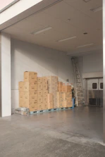 brown cardboard boxes on white floor tiles