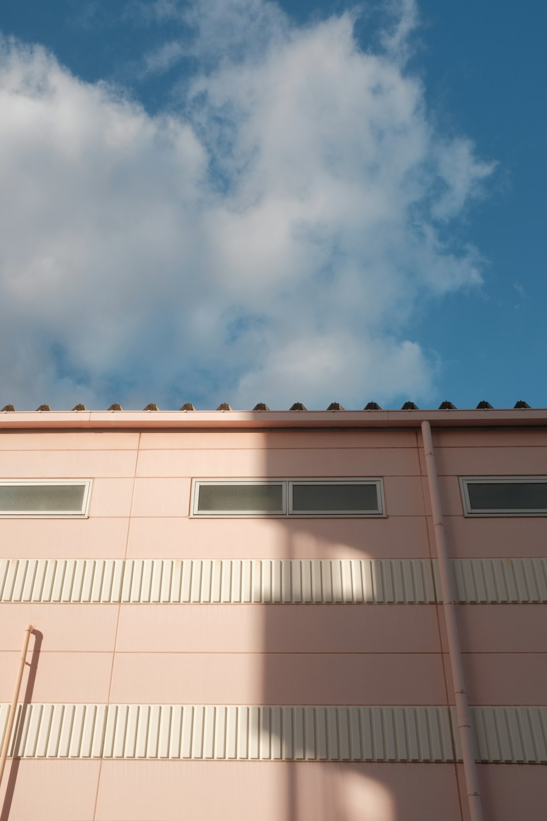 brown concrete building under blue sky during daytime