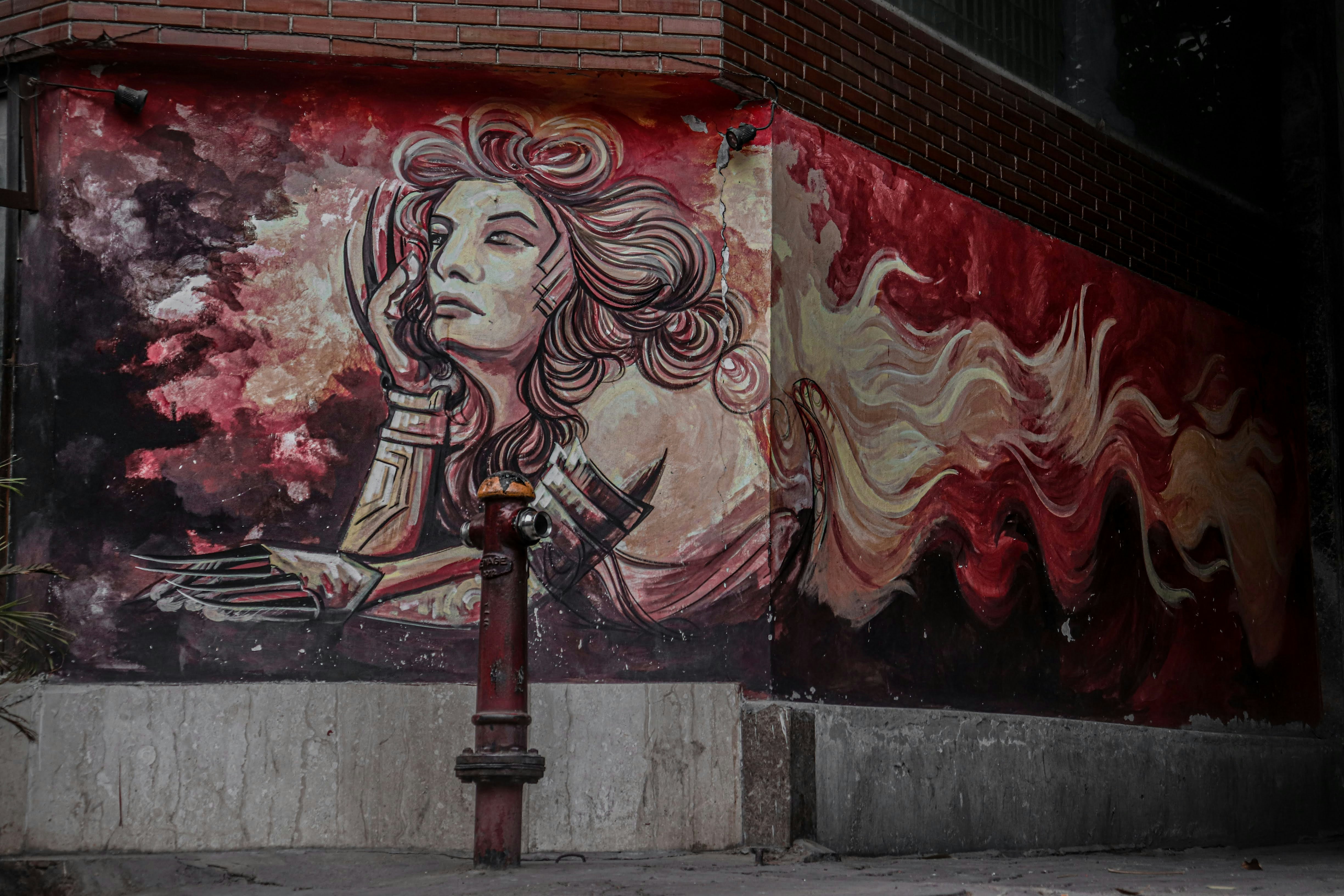 black metal stand near red and white wall