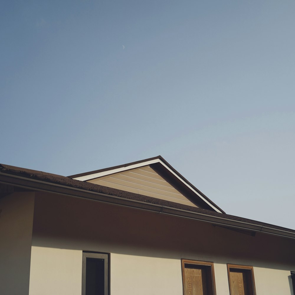 white and brown concrete house under blue sky during daytime