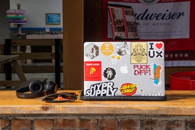 Close-up of a laptop adorned with stylish vinyl stickers from the art category.