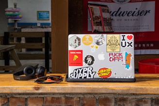 Close-up of a laptop adorned with stylish vinyl stickers from the art category.