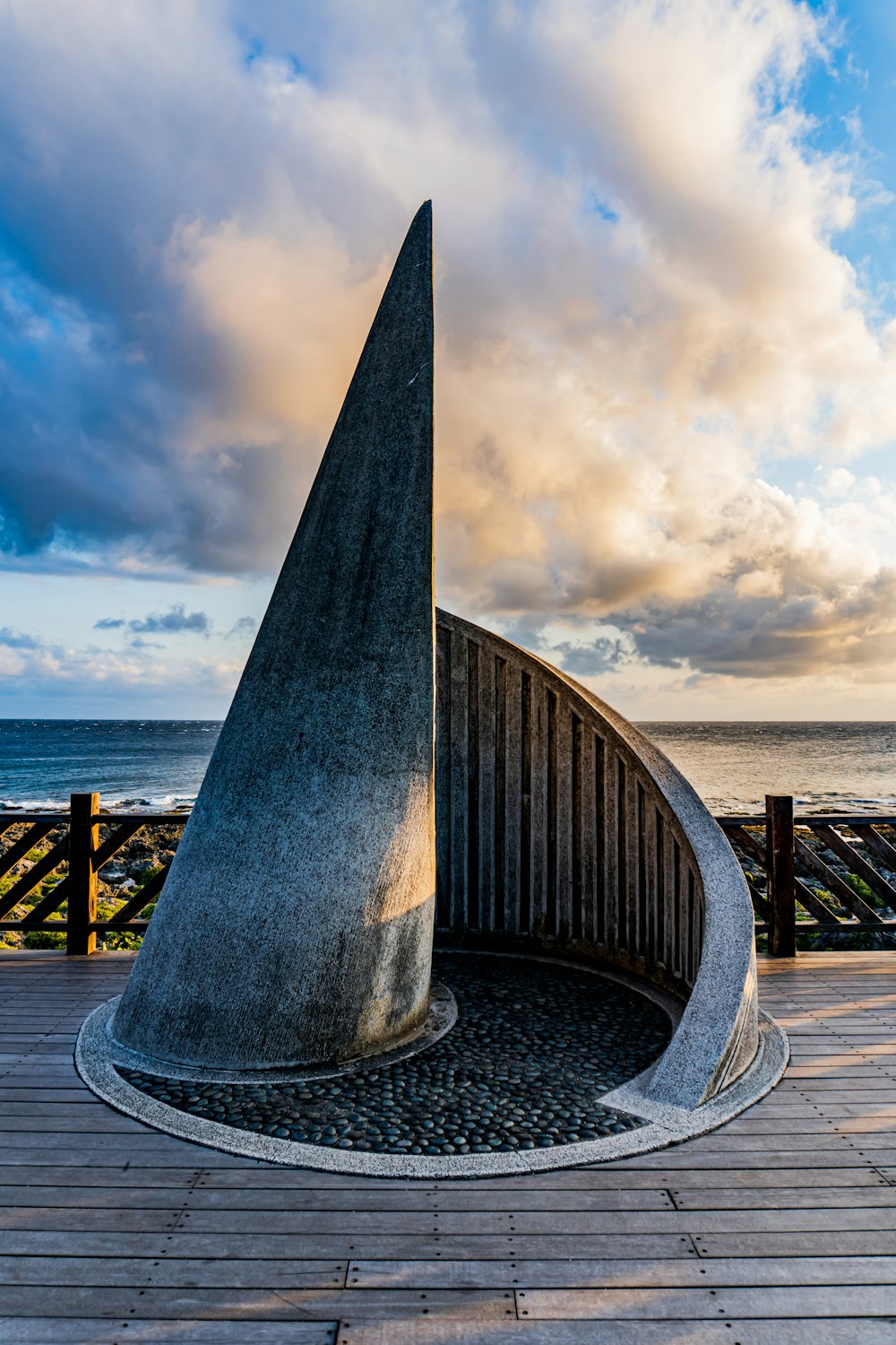 brown wooden dock on sea under white clouds during daytime