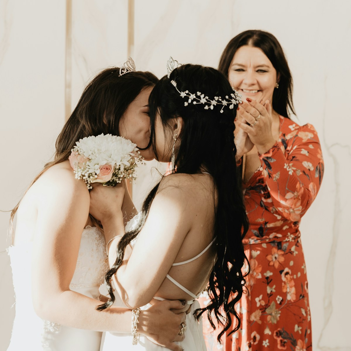 2 women in red and white floral dress