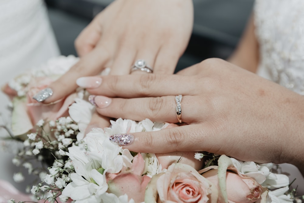 woman in white wedding dress wearing silver diamond ring