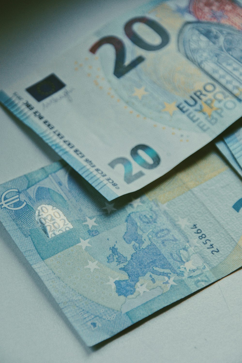 20 euro bill on white paper