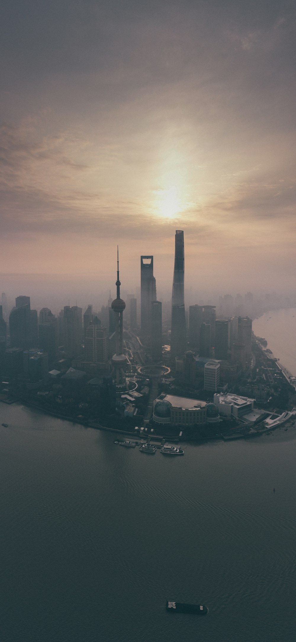 high rise buildings near body of water during daytime