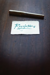 white printer paper on brown wooden table