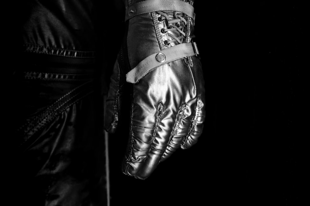 black leather boxing gloves on black textile