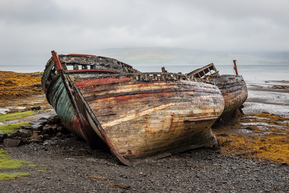 brown wooden boat on brown sand during daytime