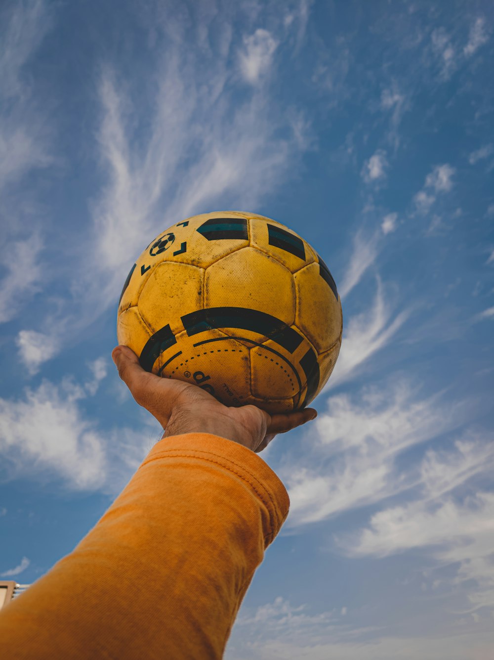 yellow and black soccer ball