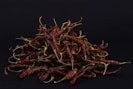 red chili on black surface