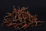 red chili on black surface