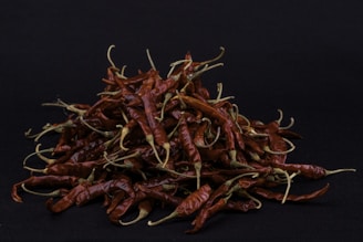 red chili on black surface