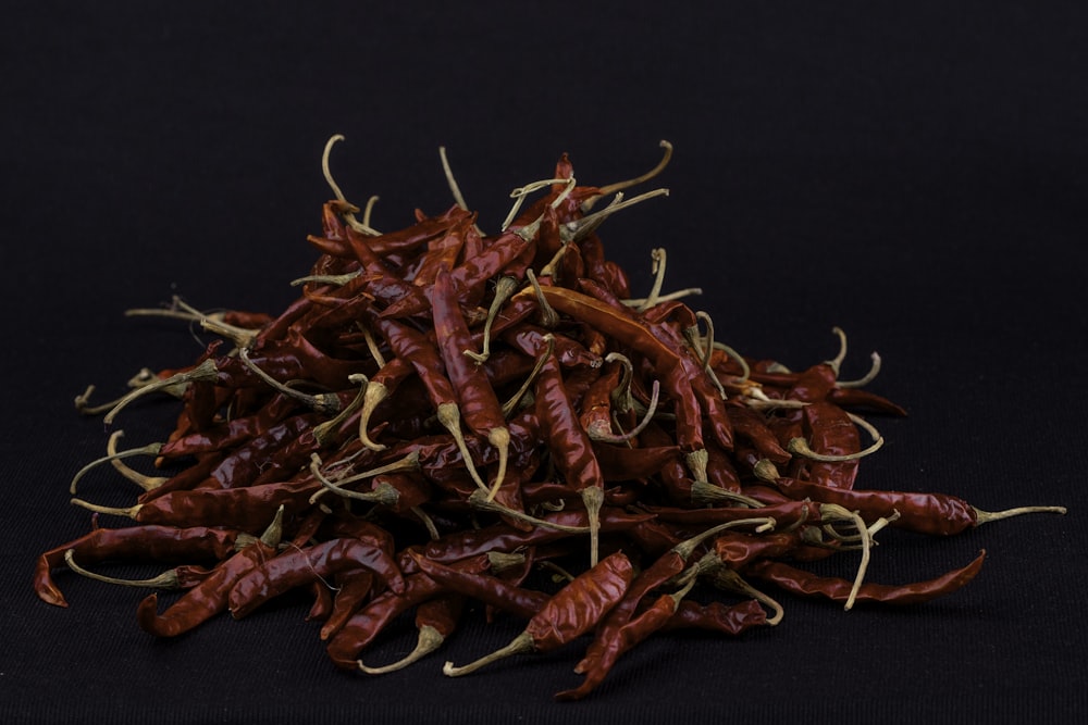 red chili on black surface