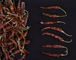 red chili peppers on black textile