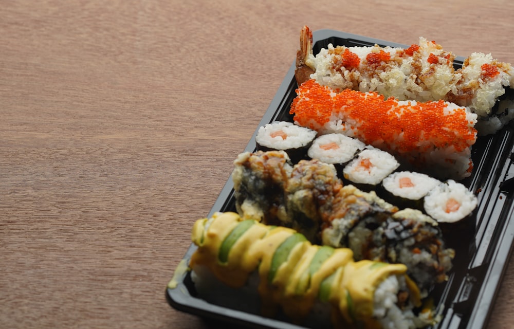 sushi on white and blue ceramic tray