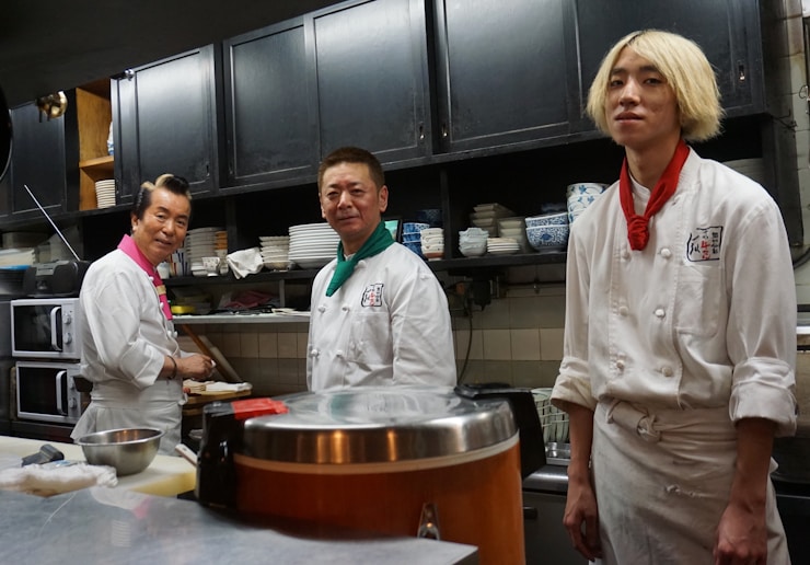 Three Japanese chefs posing for the camera