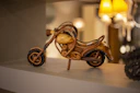 gold and black bicycle figurine