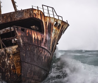 brown ship on sea waves