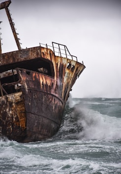 brown ship on sea waves