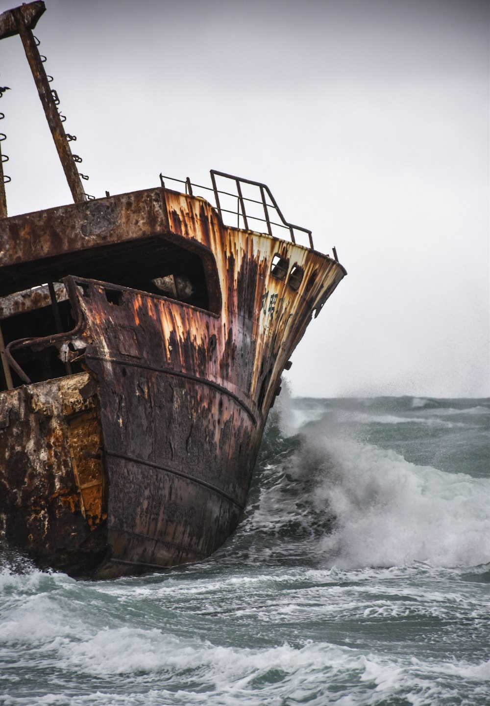 brown ship on sea waves