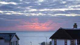 Scenic view of a beautiful seaside home in Mallorca at sunset.