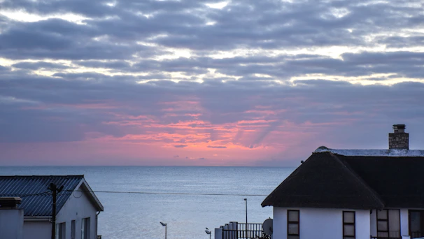 A cozy seaside home with a view of the Black Sea at sunset.