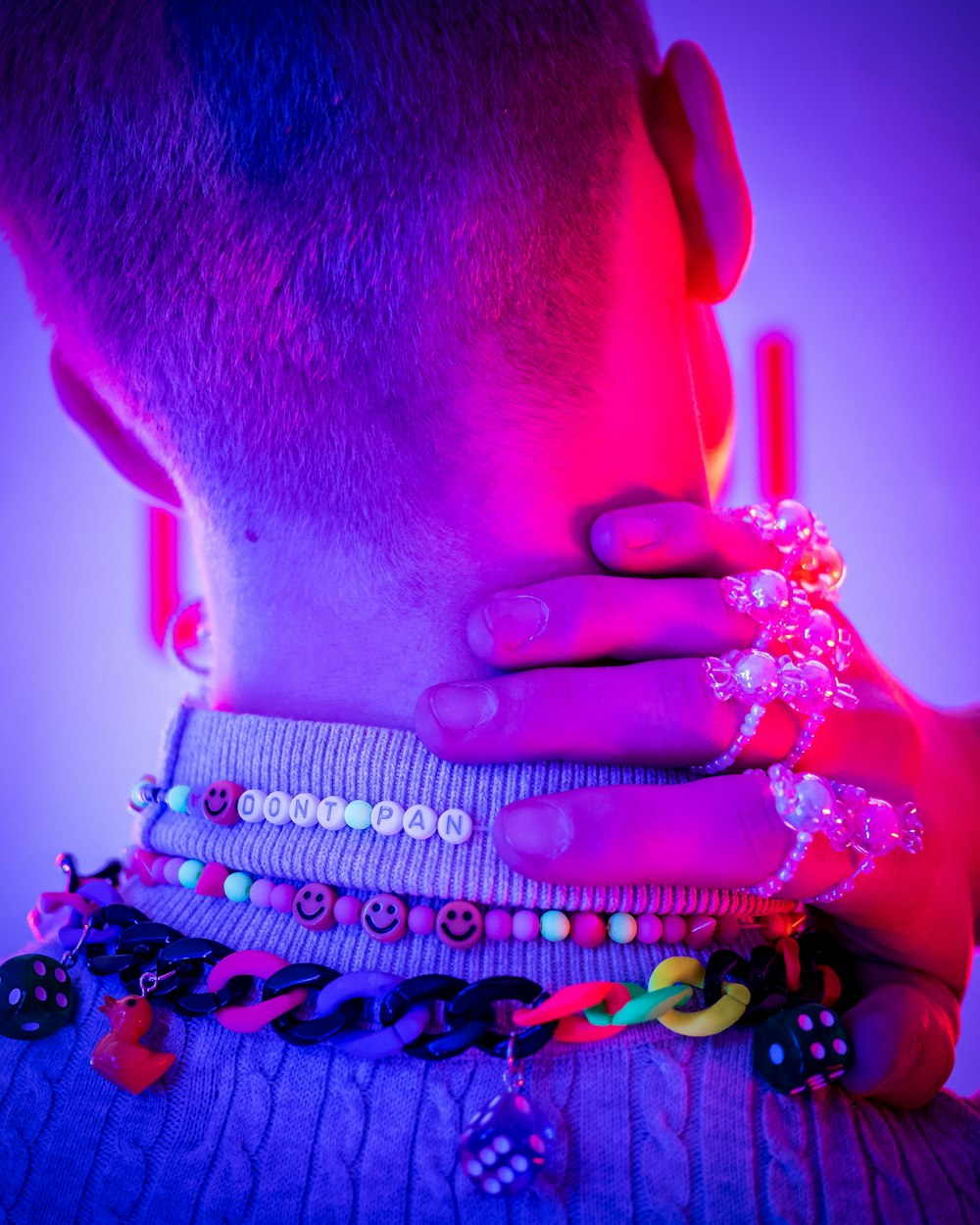 man in black and white beaded necklace