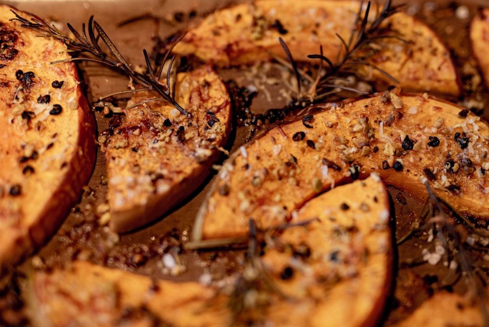 sliced pizza on brown wooden table