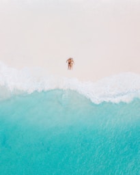 person surfing on sea waves during daytime