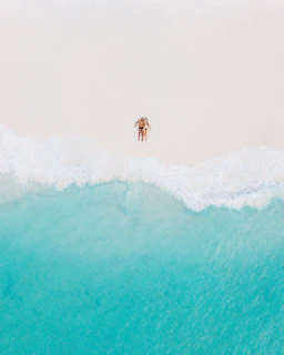 person surfing on sea waves during daytime