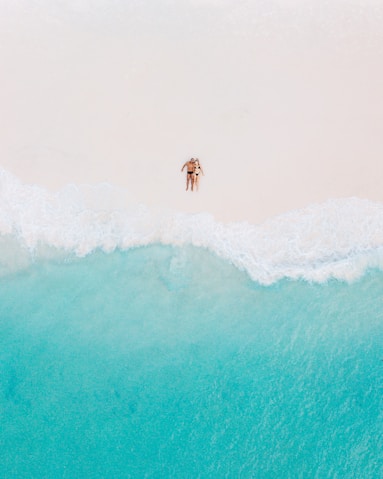 person surfing on sea waves during daytime