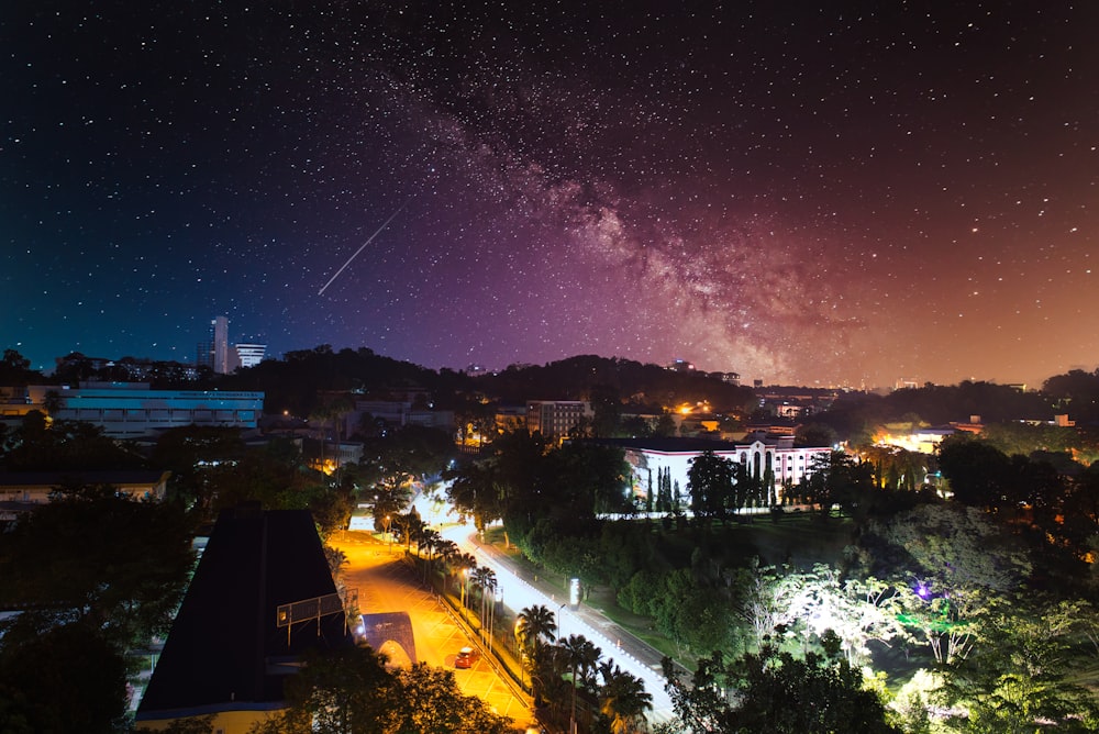 city with high rise buildings during night time