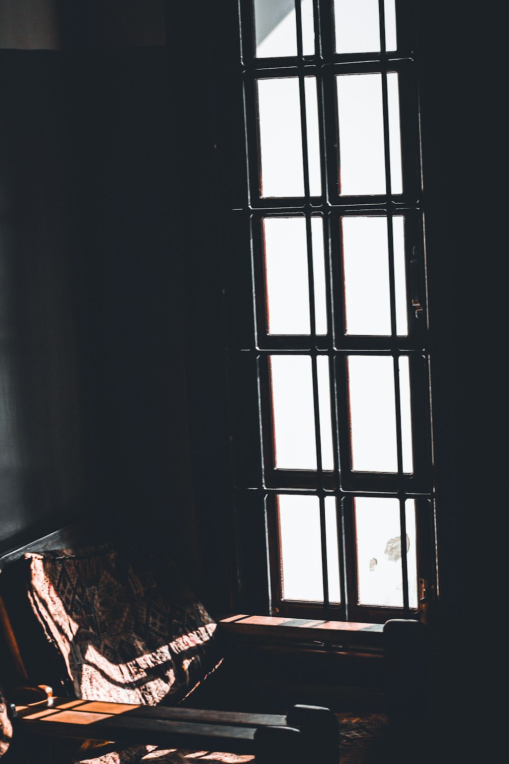 brown wooden framed glass window