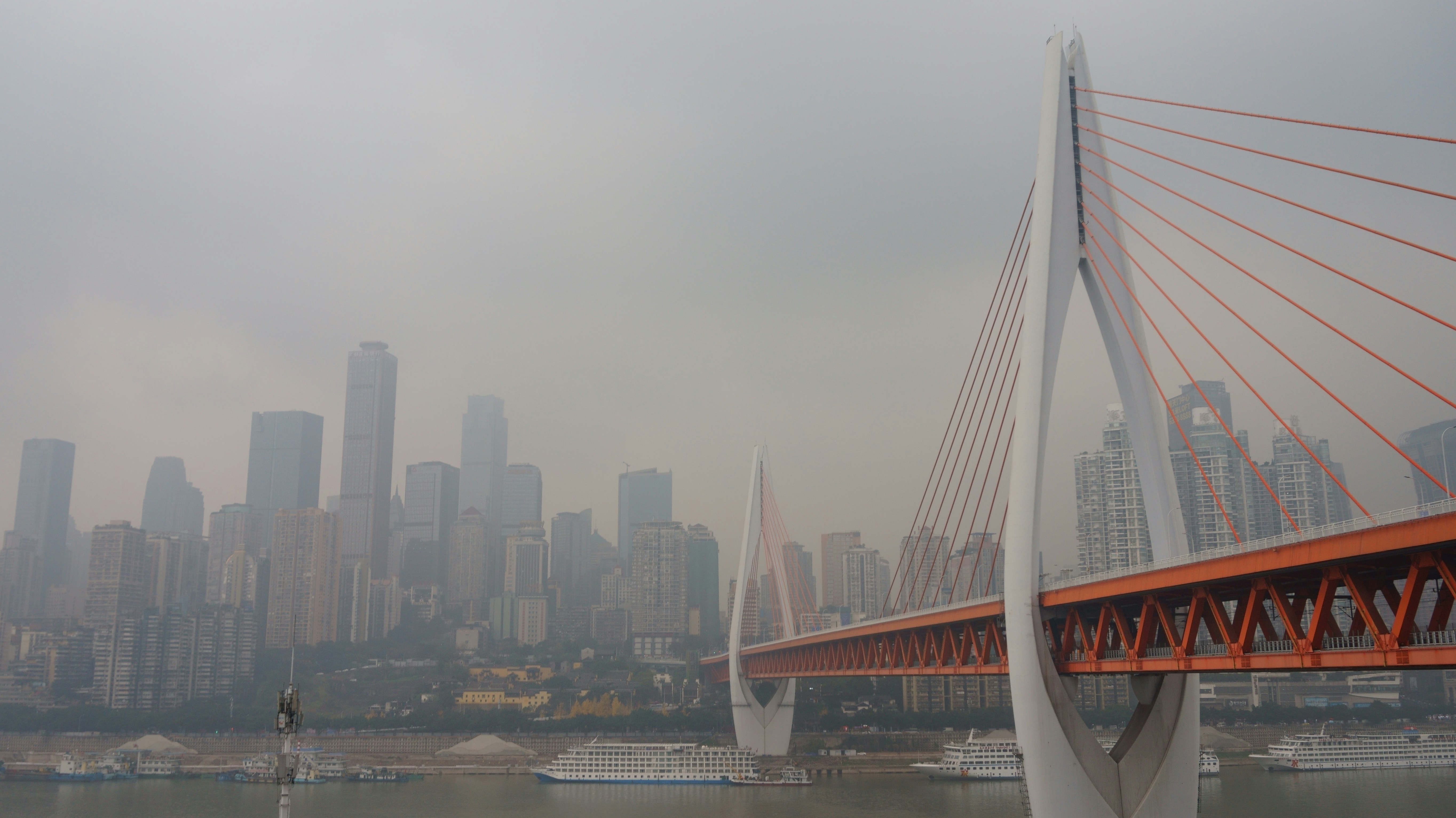 white bridge over body of water during daytime