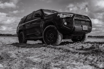 brown suv on white snow covered ground during daytime