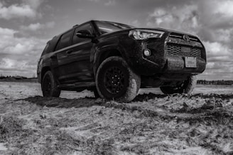 brown suv on white snow covered ground during daytime