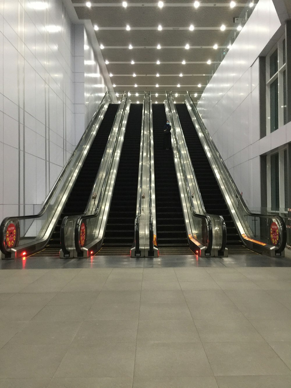 black and red escalator in building