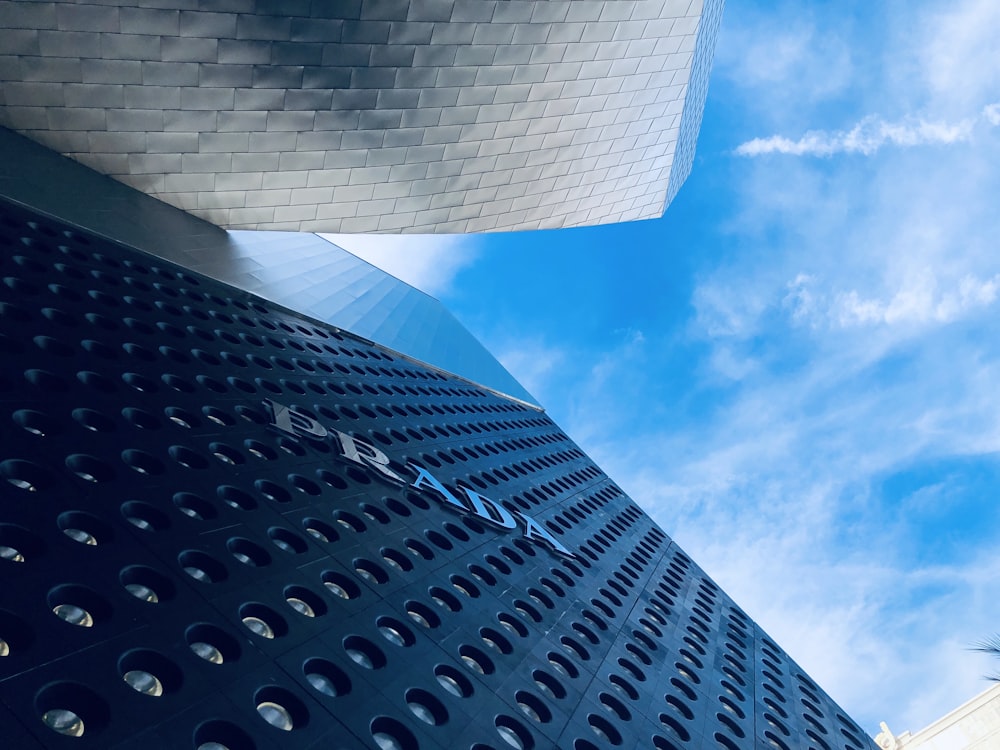 white clouds over gray building