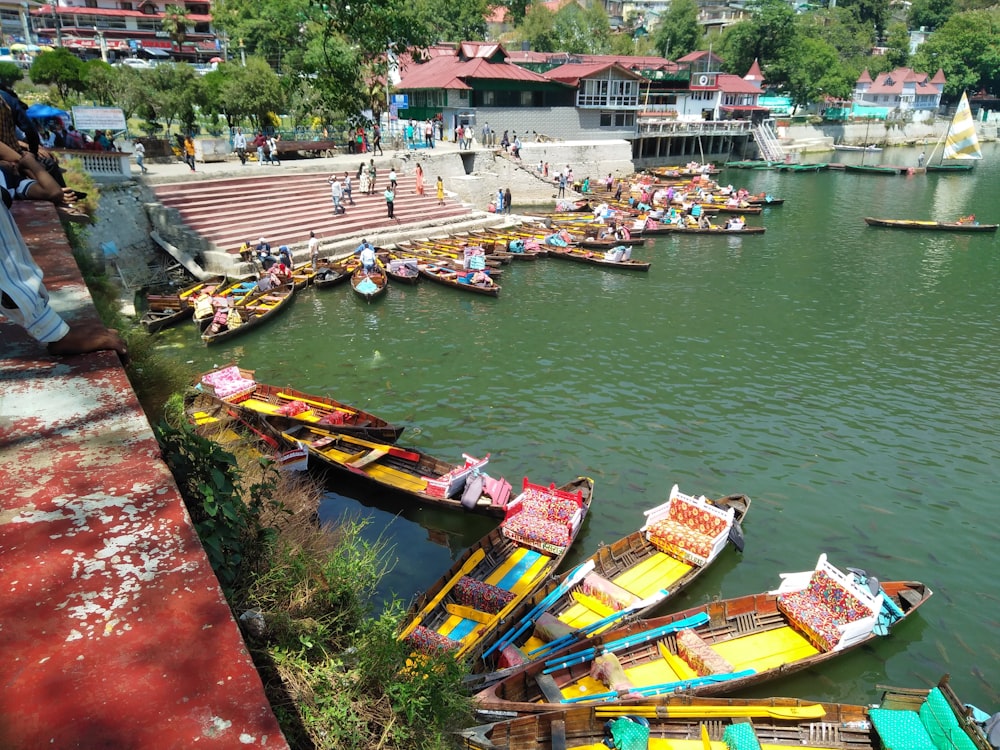 boat on river near houses during daytime