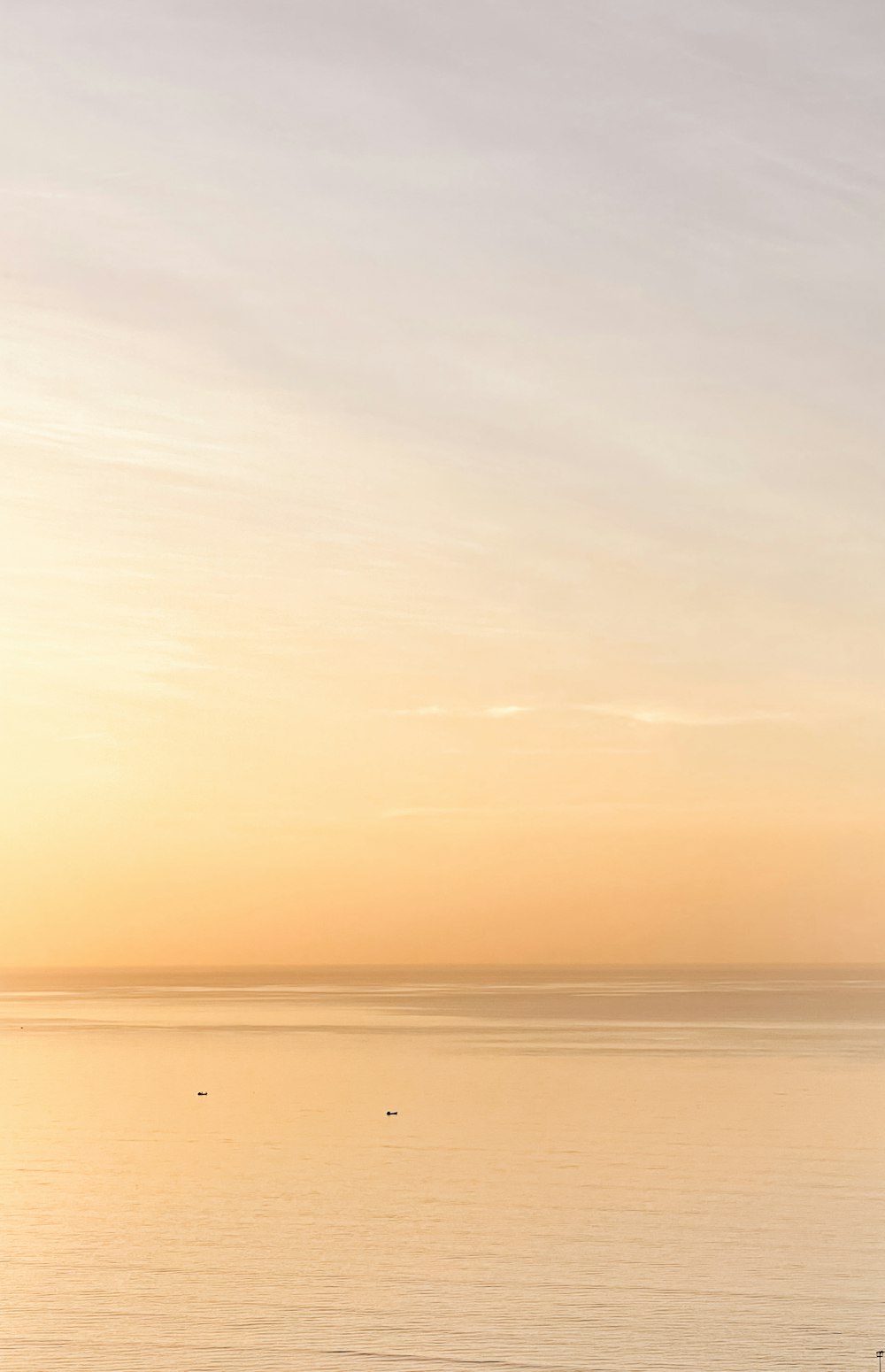 body of water under cloudy sky during daytime