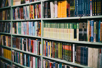 books on brown wooden shelf