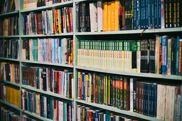 books on brown wooden shelf