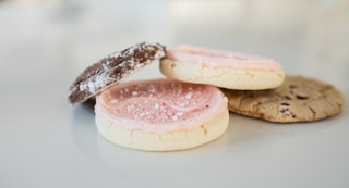 white and pink cake on white ceramic plate