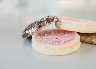 white and pink cake on white ceramic plate