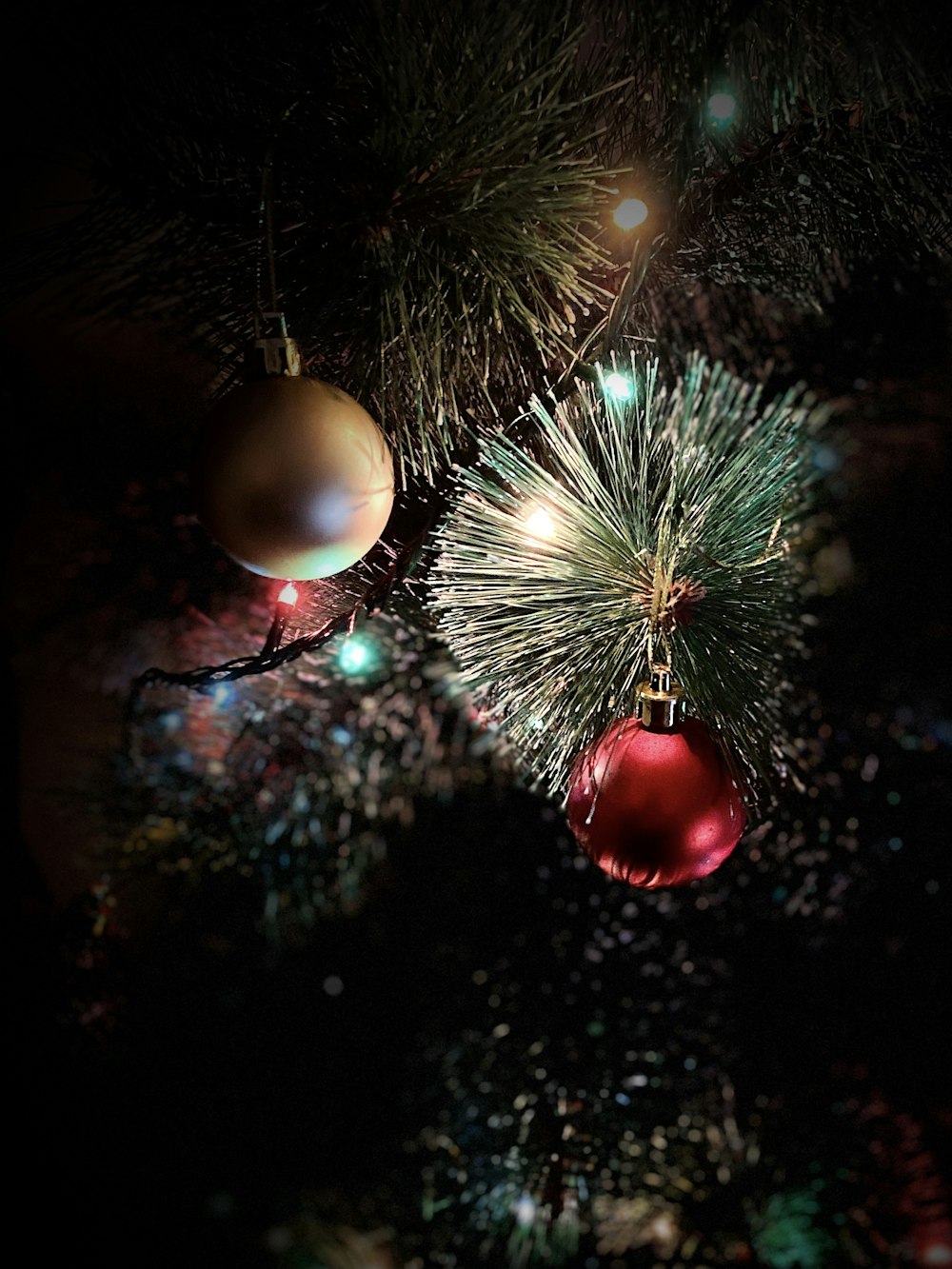 red and silver baubles on green christmas tree