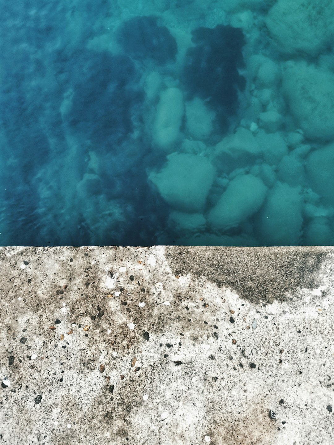 white and black stone on water