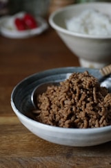 brown food on white ceramic bowl