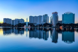 city skyline across body of water during daytime